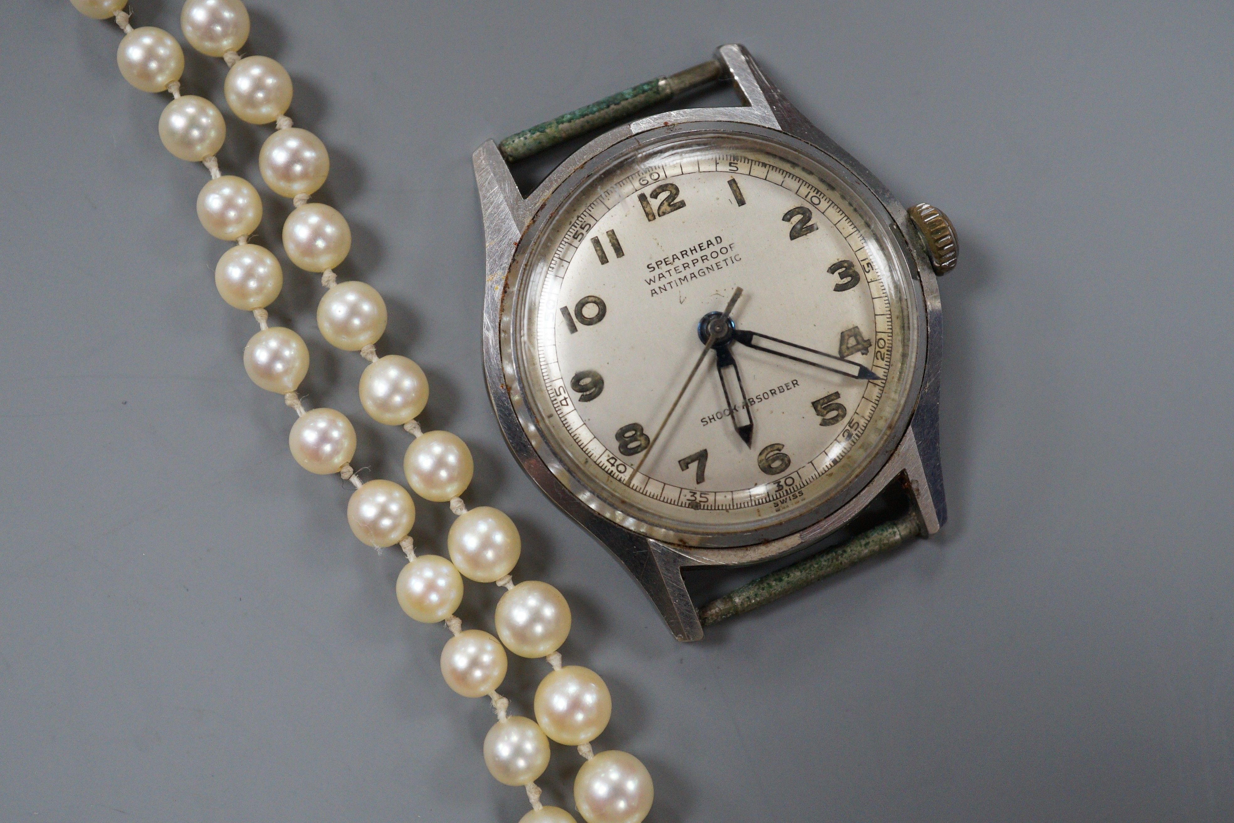 A single strand graduated cultured pearl necklace, with four stone diamond set white metal clasp, 50cm, gross weight 14.4 grams (pearls have not been tested).